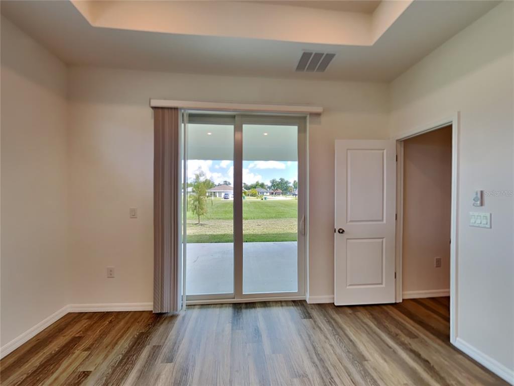 16234 Maya Circle Punta Gorda, FL 33955 - Photo 8 of 19 a view of an empty room with glass door