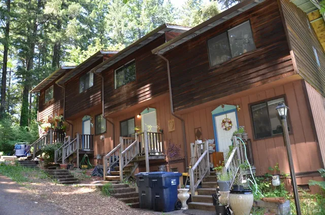 a view of a house with a yard porch and sitting area
