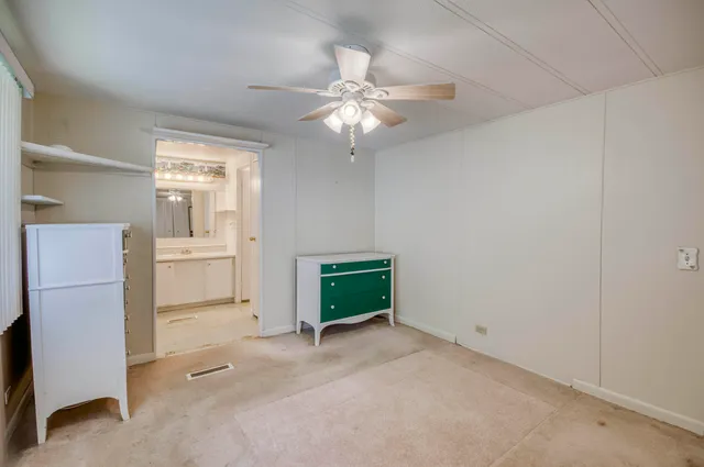 a room with a stove and a refrigerator