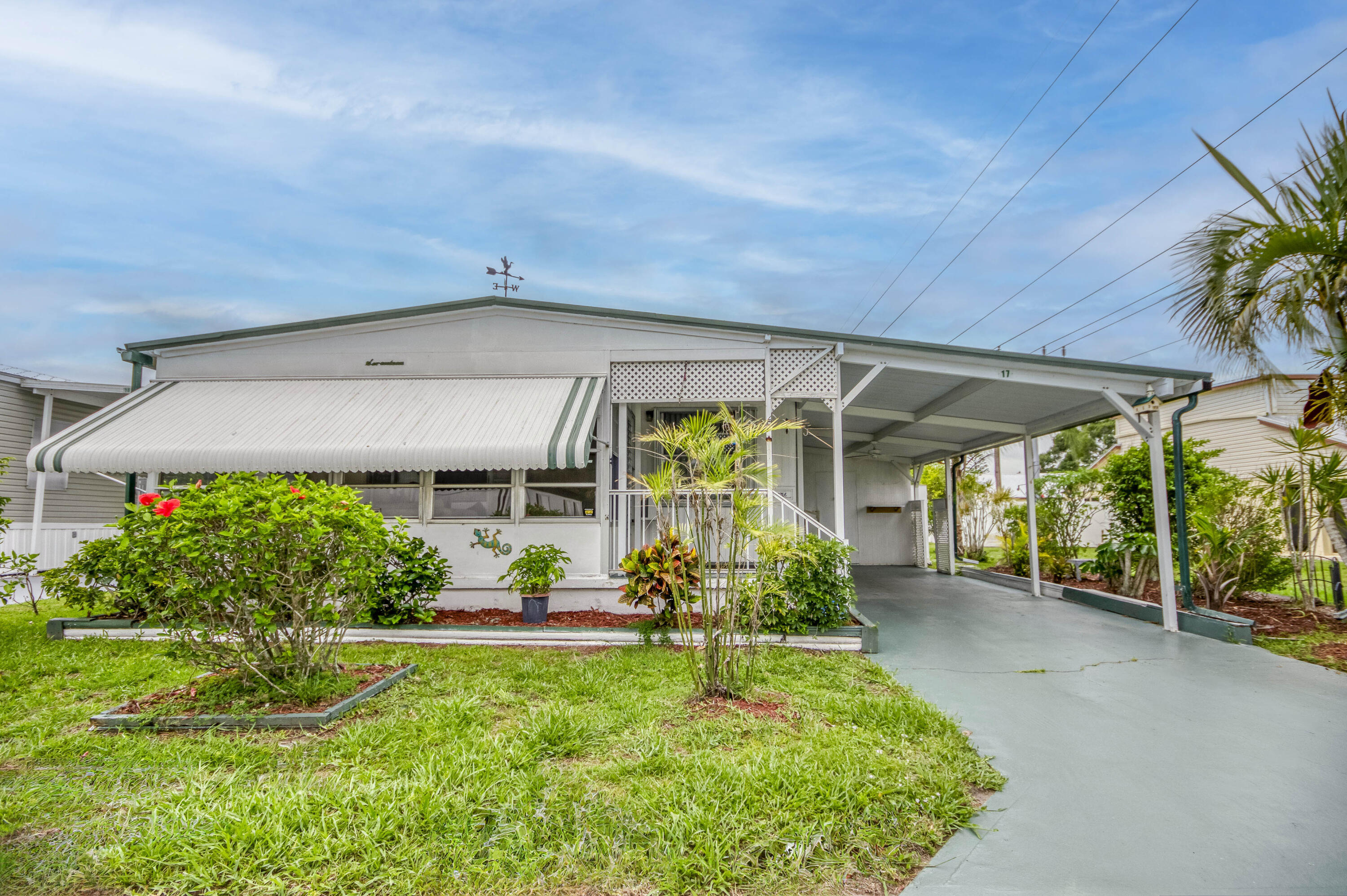 4800 Southeast Federal Highway, Unit 17 Stuart, FL 34997 - Photo 2 of 29 a view of a porch in front of a house