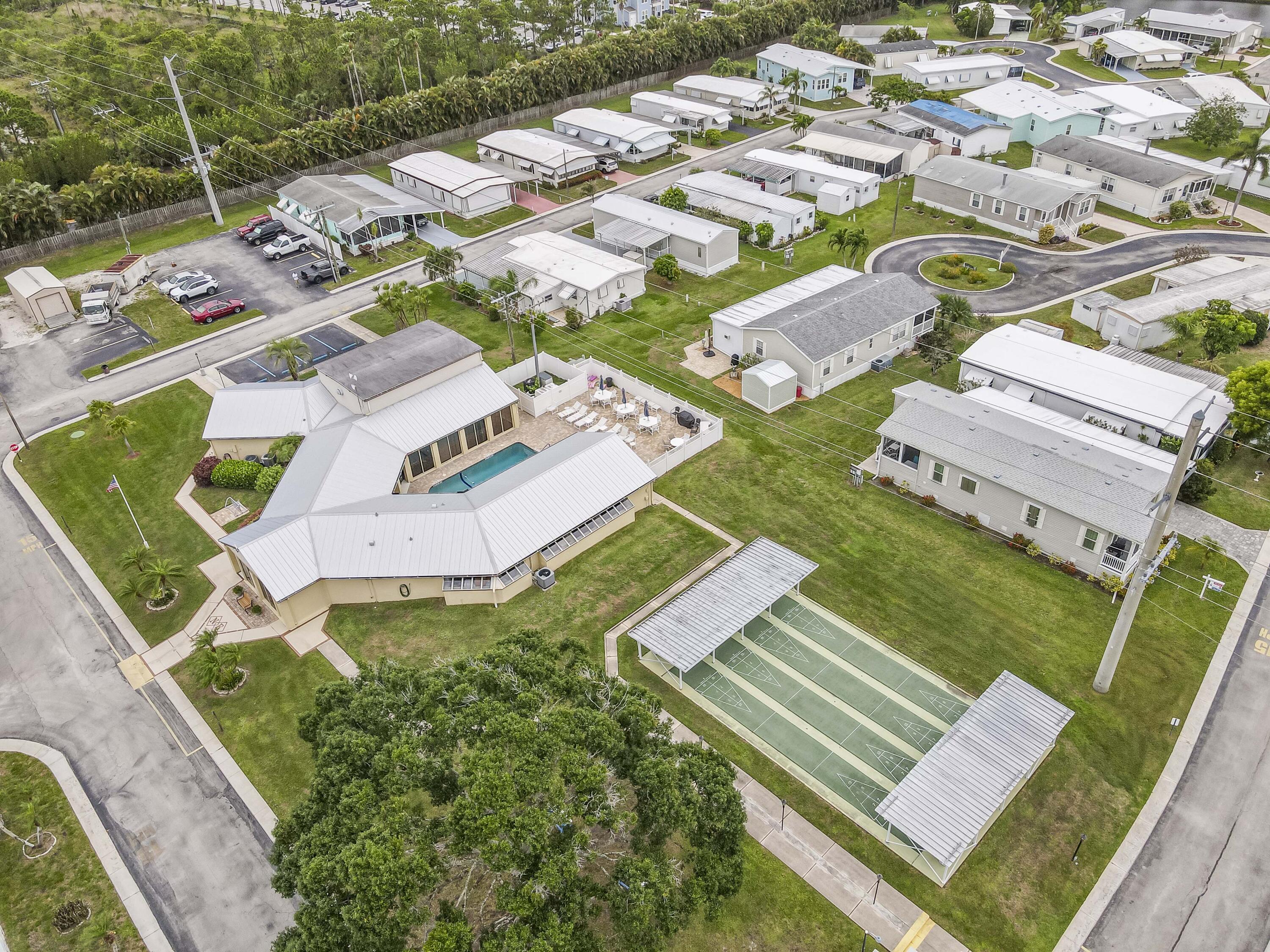4800 Southeast Federal Highway, Unit 17 Stuart, FL 34997 - Photo 24 of 29 an aerial view of a house with a garden
