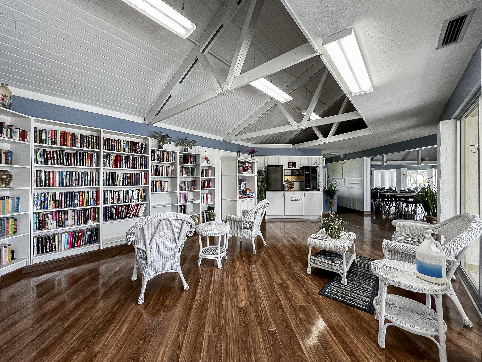 4800 Southeast Federal Highway, Unit 17 Stuart, FL 34997 - Photo 27 of 29 a work room with furniture wooden floor and book shelf