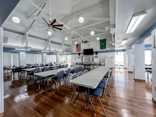 a view of a dining area with furniture window and wooden floor