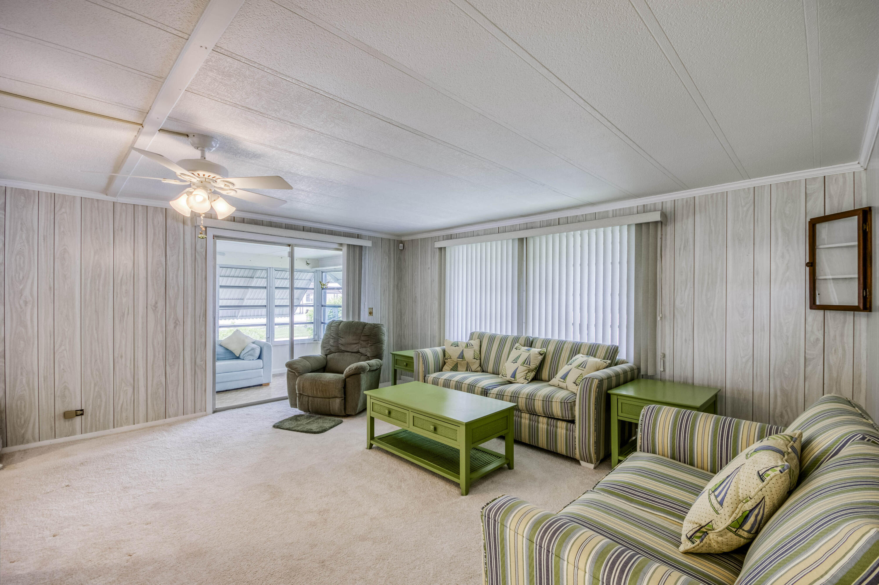 4800 Southeast Federal Highway, Unit 17 Stuart, FL 34997 - Photo 5 of 29 a living room with furniture and a large window