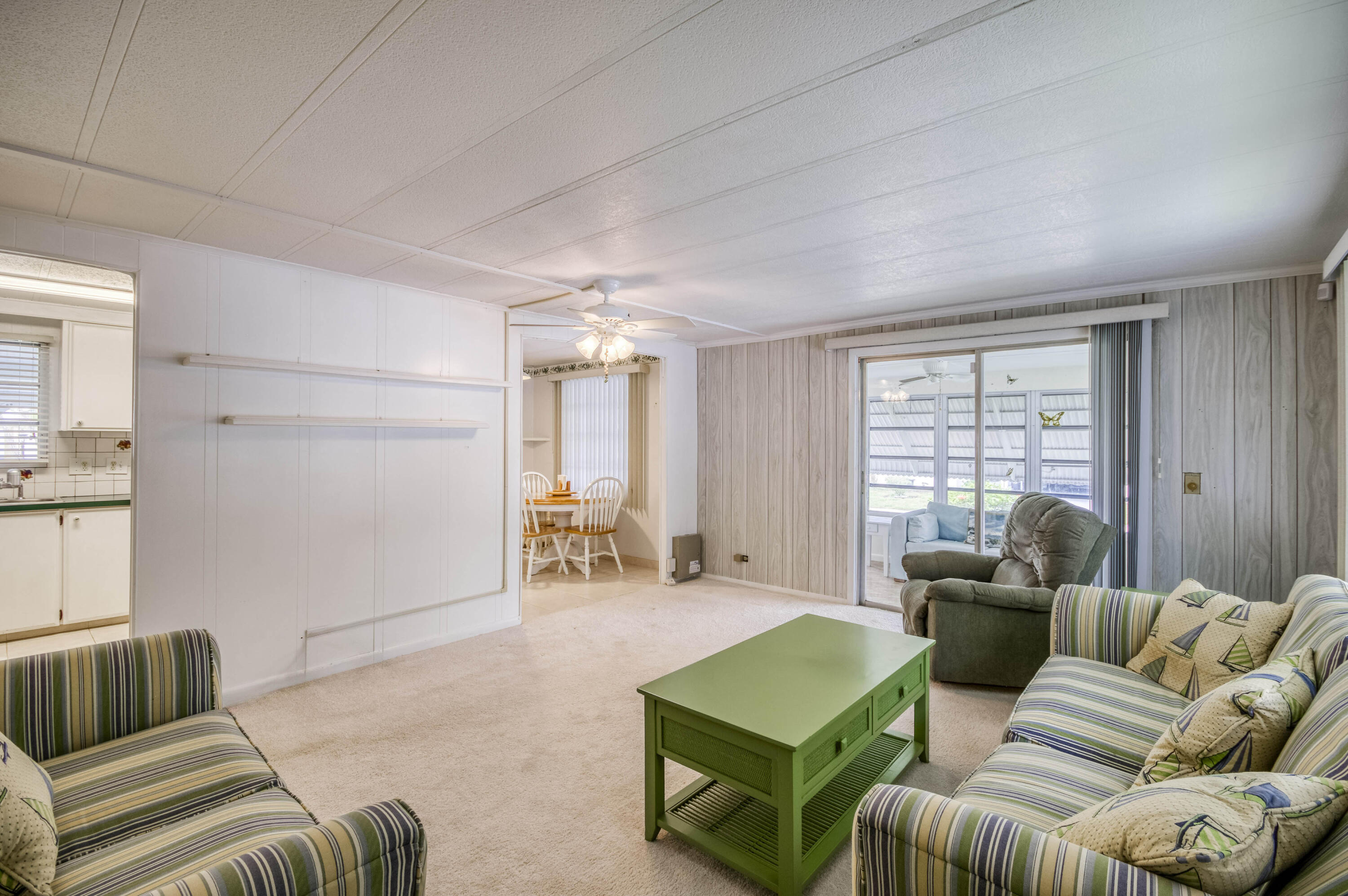 4800 Southeast Federal Highway, Unit 17 Stuart, FL 34997 - Photo 6 of 29 a living room with furniture and a large window