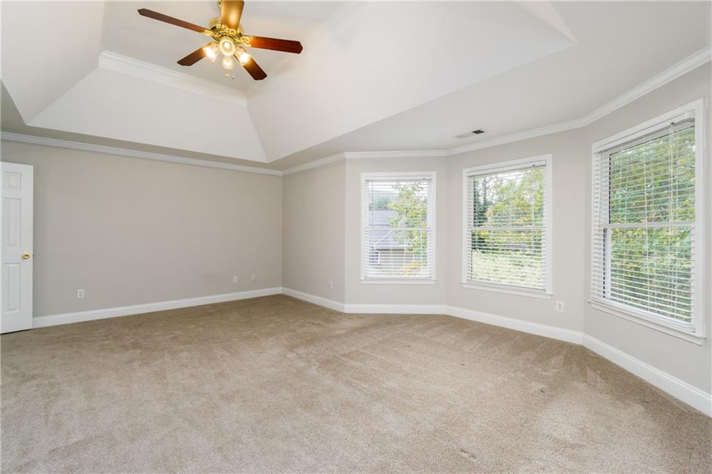 6710 Timber Cove Cumming, GA 30041 - Photo 26 of 51 an empty room with windows and fan