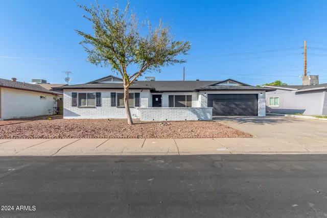front view of a house with a street