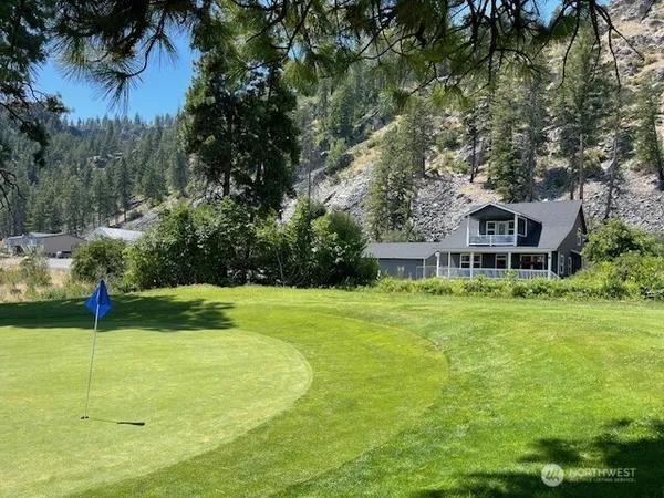 a view of a house with a big yard