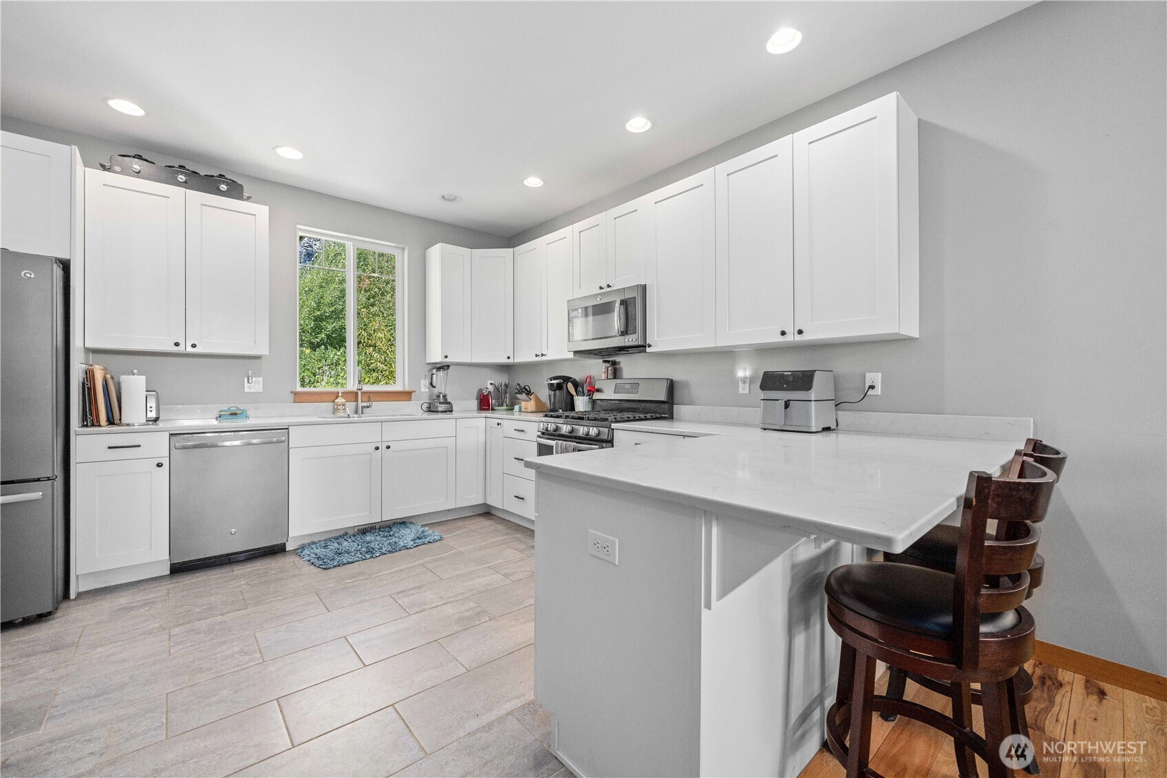 48 Golf Course Drive Pateros, WA 98846 - Photo 15 of 37 a kitchen with a sink window and cabinets