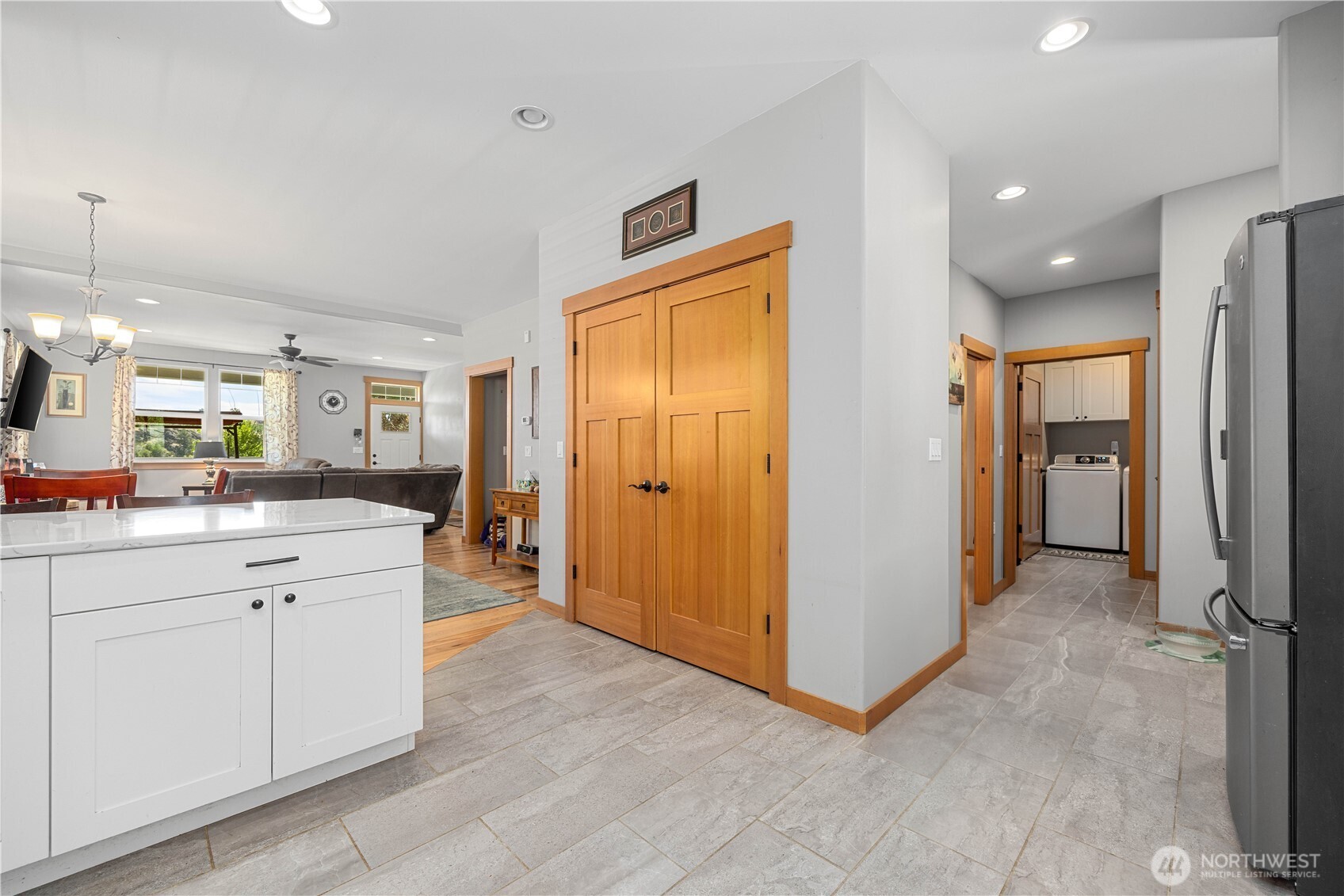 48 Golf Course Drive Pateros, WA 98846 - Photo 17 of 37 a view of a hallway with wooden floor and a living room
