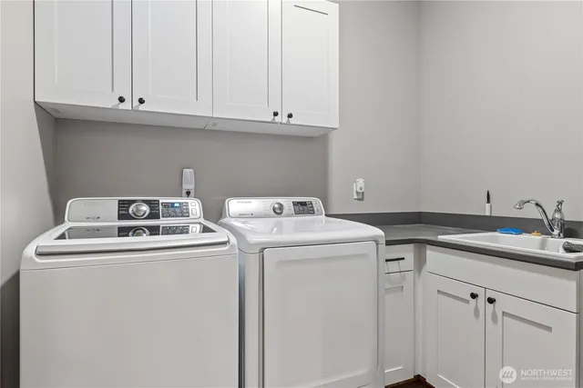 a utility room with dryer and washer