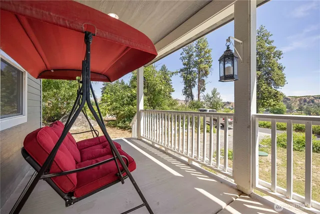 a view of a two chairs in the balcony