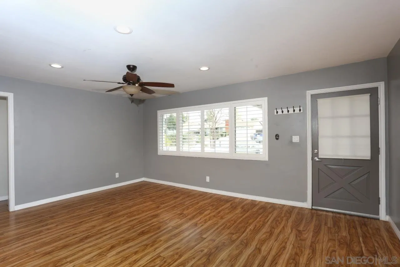 1229 Rees Road Escondido, CA 92026 - Photo 8 of 44 a view of empty room with wooden floor and fan