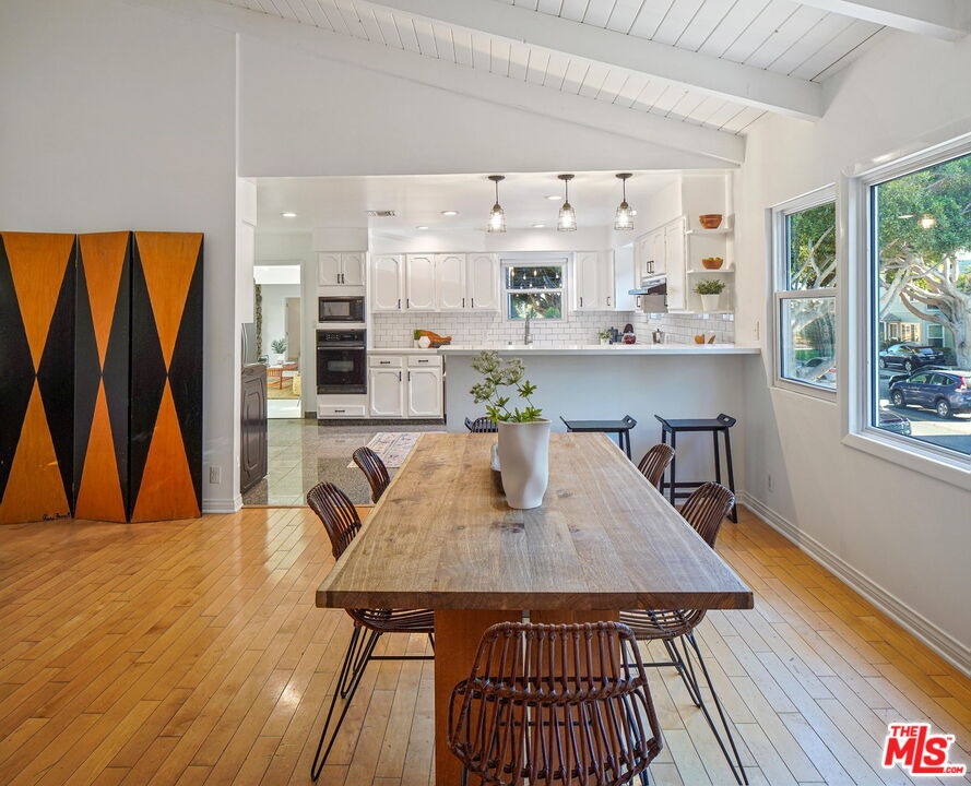 1102 Maple Street Santa Monica, CA 90405 - Photo 15 of 51 a view of a dining room with furniture and wooden floor