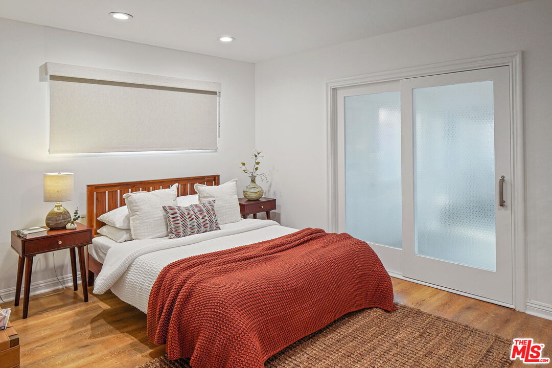 1102 Maple Street Santa Monica, CA 90405 - Photo 29 of 51 a bedroom with a bed and a mirror