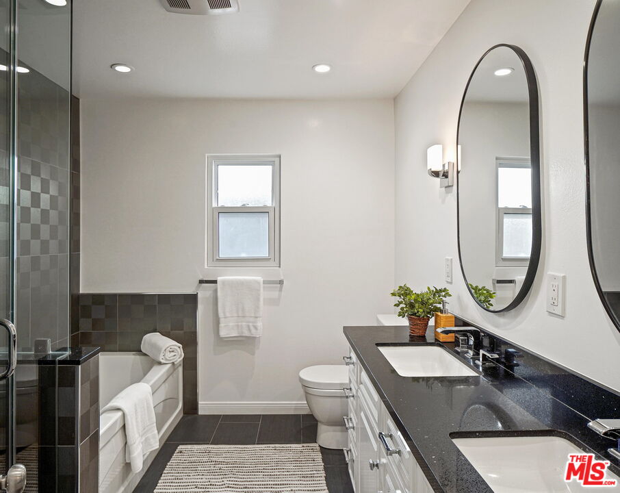 1102 Maple Street Santa Monica, CA 90405 - Photo 30 of 51 a bathroom with a sink a mirror and a toilet