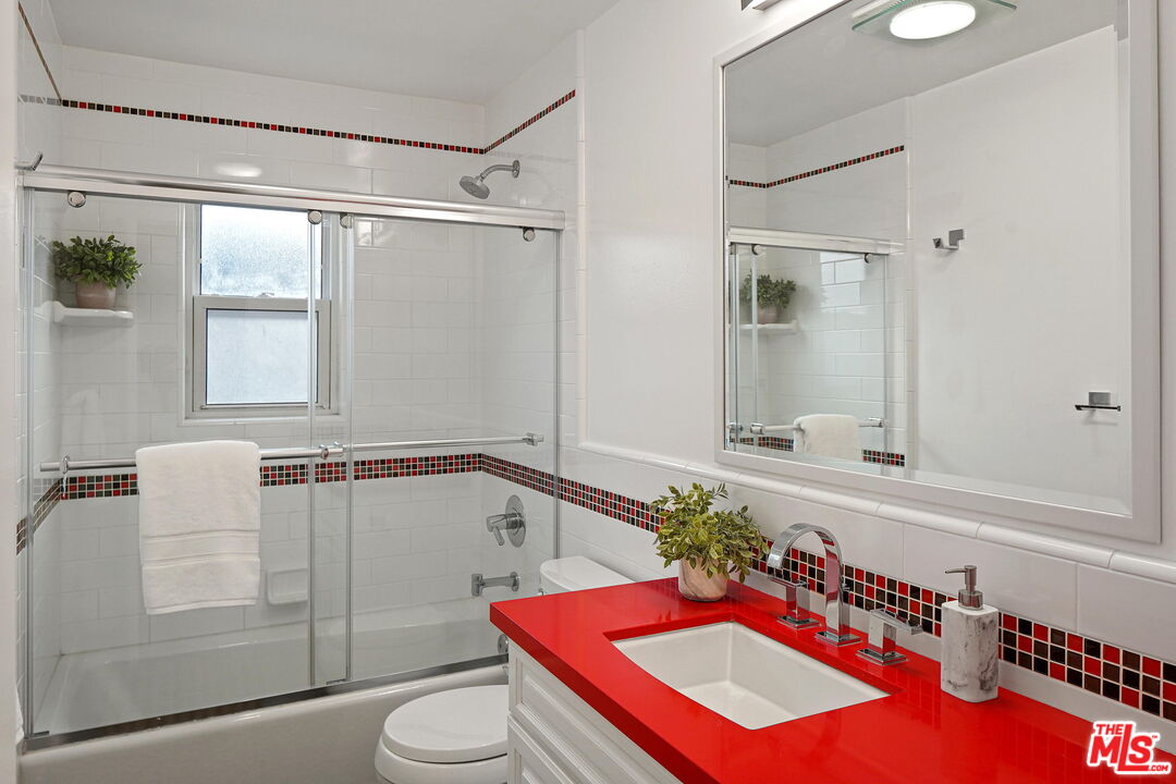 1102 Maple Street Santa Monica, CA 90405 - Photo 34 of 51 a bathroom with a sink mirror vanity and toilet