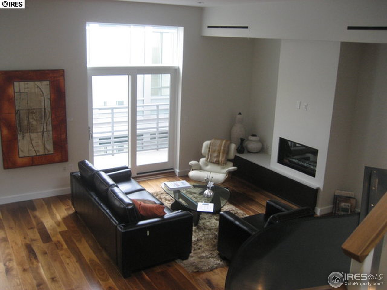 1655 Walnut Street, Unit 305 Boulder, CO 80302 - Photo 13 of 25 a living room with furniture fireplace and a window