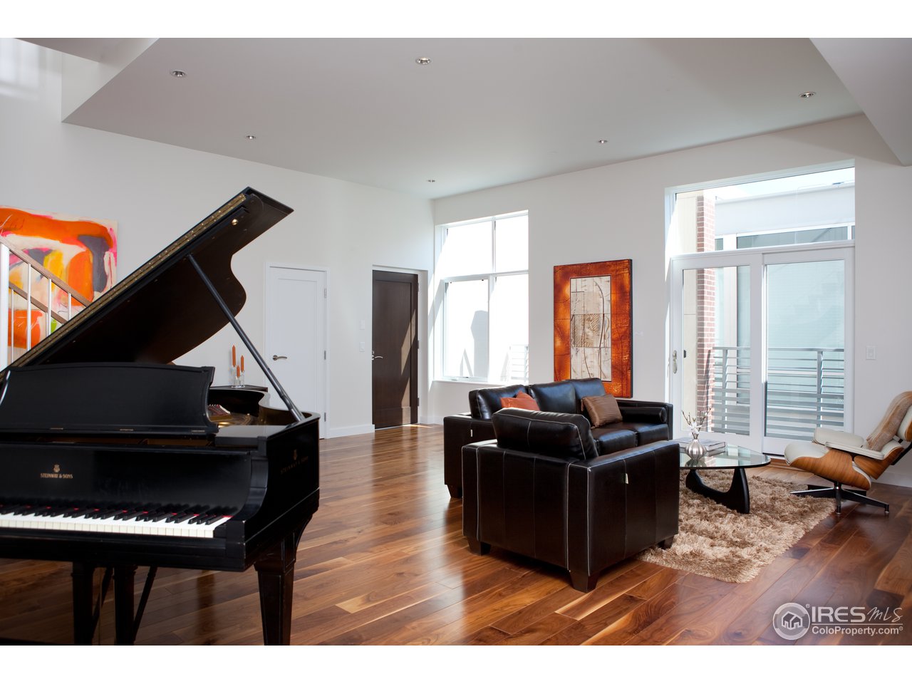 1655 Walnut Street, Unit 305 Boulder, CO 80302 - Photo 14 of 25 a living room with furniture and a flat screen tv
