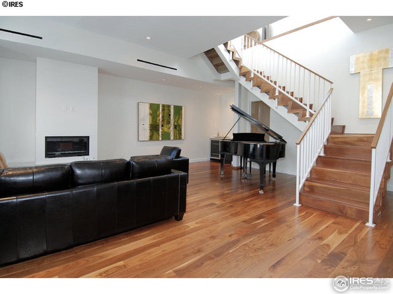 1655 Walnut Street, Unit 305 Boulder, CO 80302 - Photo 15 of 25 a living room with furniture and wooden floor