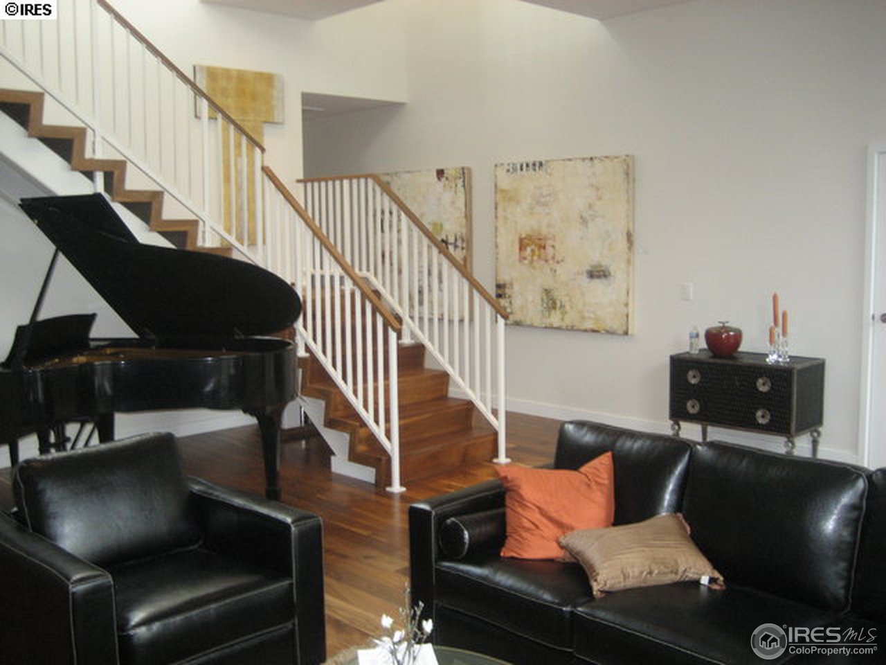 1655 Walnut Street, Unit 305 Boulder, CO 80302 - Photo 16 of 25 a living room with furniture and stairs