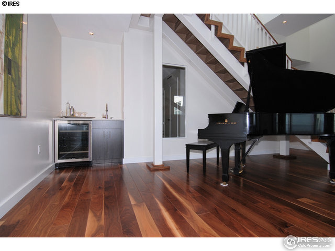 1655 Walnut Street, Unit 305 Boulder, CO 80302 - Photo 17 of 25 a open kitchen with cabinets table and chairs