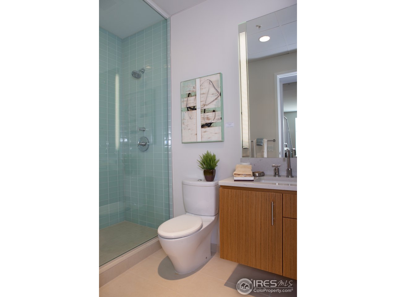 1655 Walnut Street, Unit 305 Boulder, CO 80302 - Photo 19 of 25 a bathroom with a toilet a sink and shower