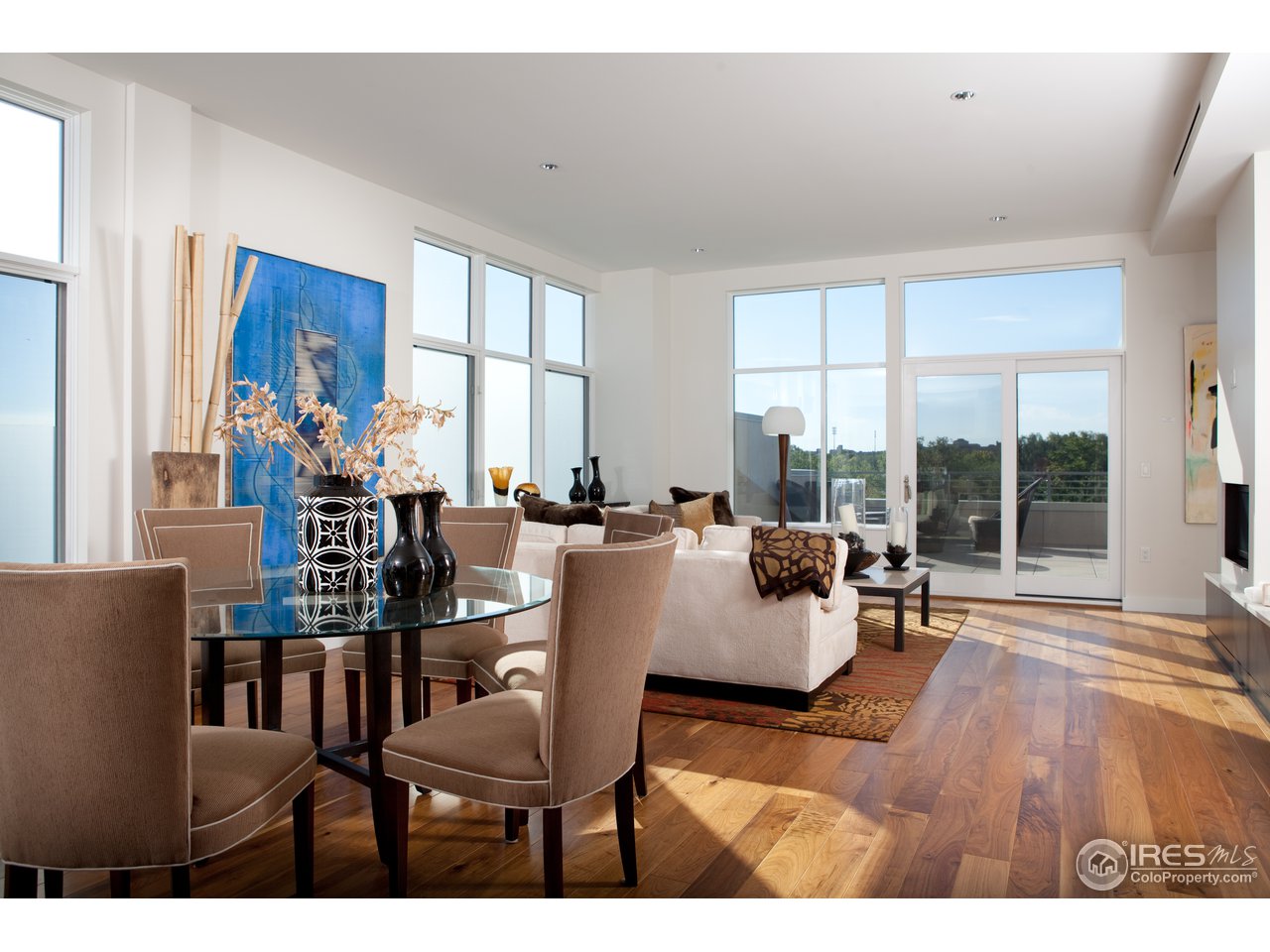 1655 Walnut Street, Unit 305 Boulder, CO 80302 - Photo 3 of 25 a living room with furniture and large windows