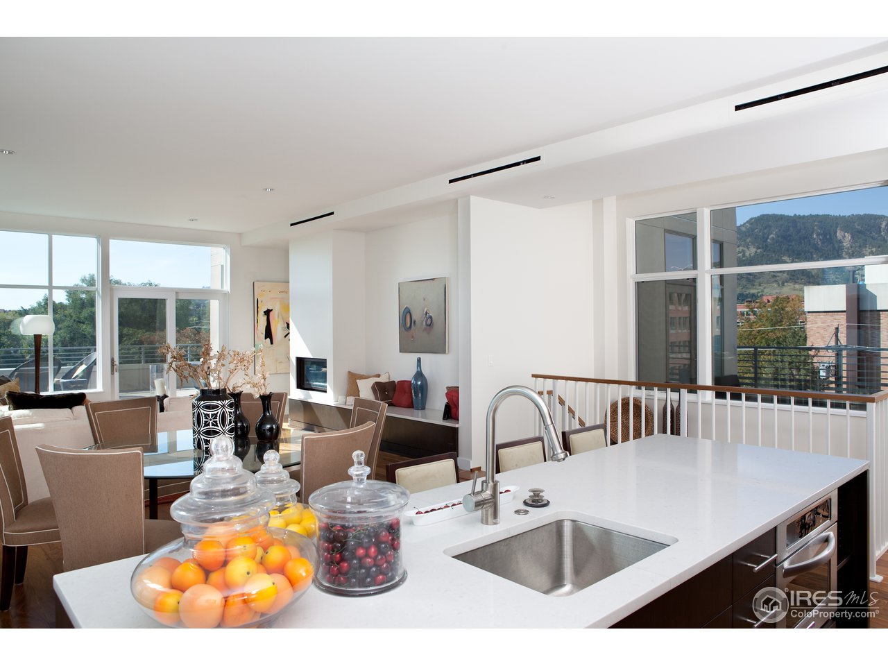 1655 Walnut Street, Unit 305 Boulder, CO 80302 - Photo 4 of 25 a living room with furniture and a table