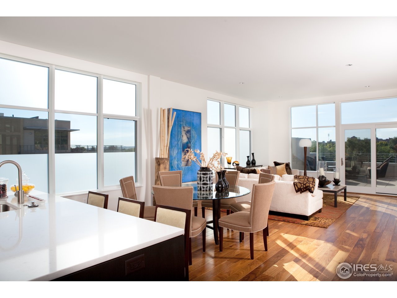 1655 Walnut Street, Unit 305 Boulder, CO 80302 - Photo 5 of 25 a living room with furniture and a large window