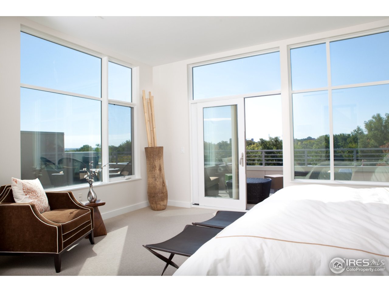 1655 Walnut Street, Unit 305 Boulder, CO 80302 - Photo 6 of 25 a living room with furniture and a large window