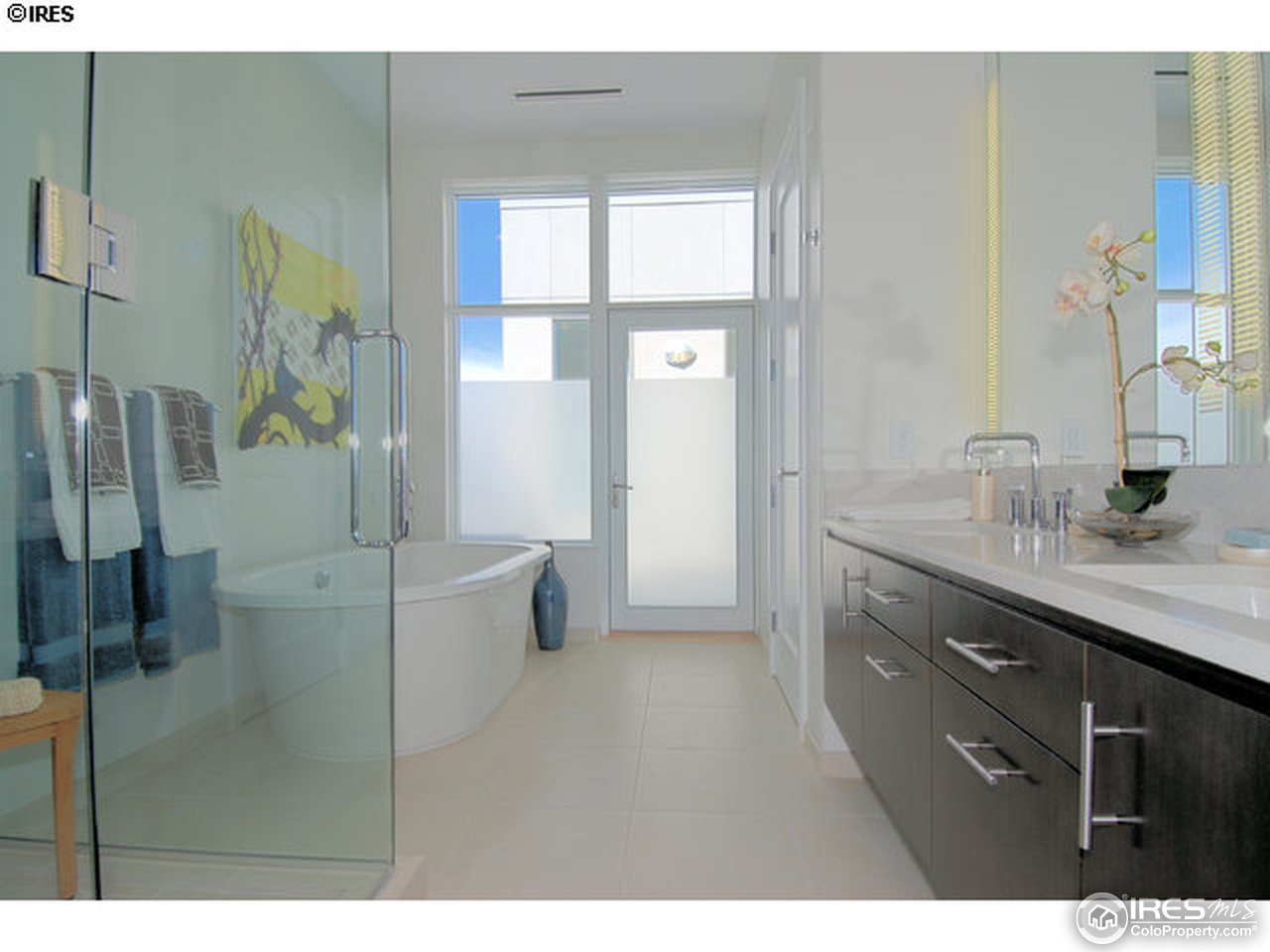 1655 Walnut Street, Unit 305 Boulder, CO 80302 - Photo 7 of 25 a bathroom with a granite countertop sink a toilet a mirror and shower