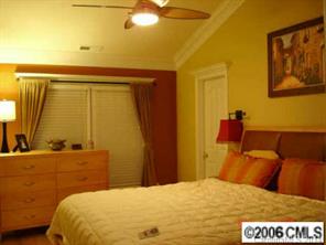 1123 Market Street, Unit 1123 Fort Mill, SC 29708 - Photo 5 of 6 a bedroom with a bed and a dresser