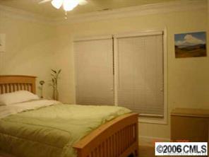 1123 Market Street, Unit 1123 Fort Mill, SC 29708 - Photo 6 of 6 a bedroom with a bed and cabinets