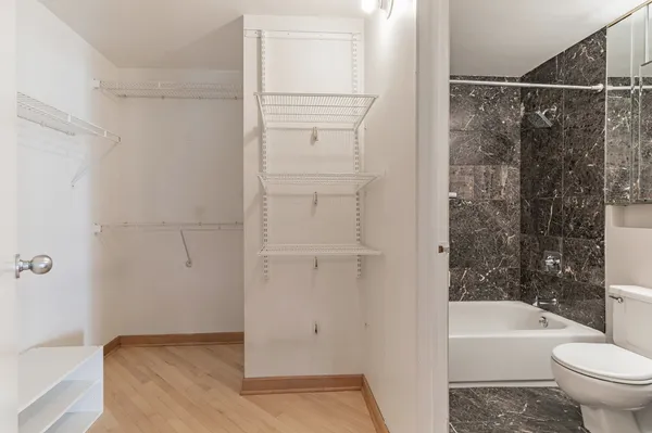 a bathroom with a shower and a toilet