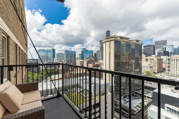 a view of a balcony with furniture