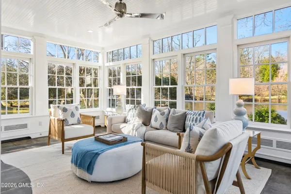 a living room with furniture and windows