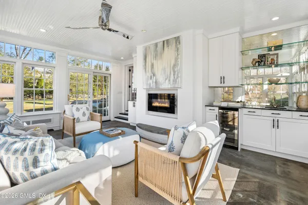 a living room with furniture windows and a fireplace