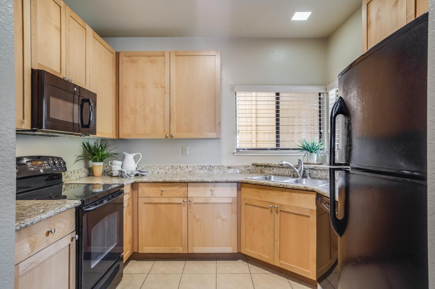 174 Copper Ridge Road San Ramon, CA 94582 - Photo 22 of 29 a kitchen with a sink stove and refrigerator