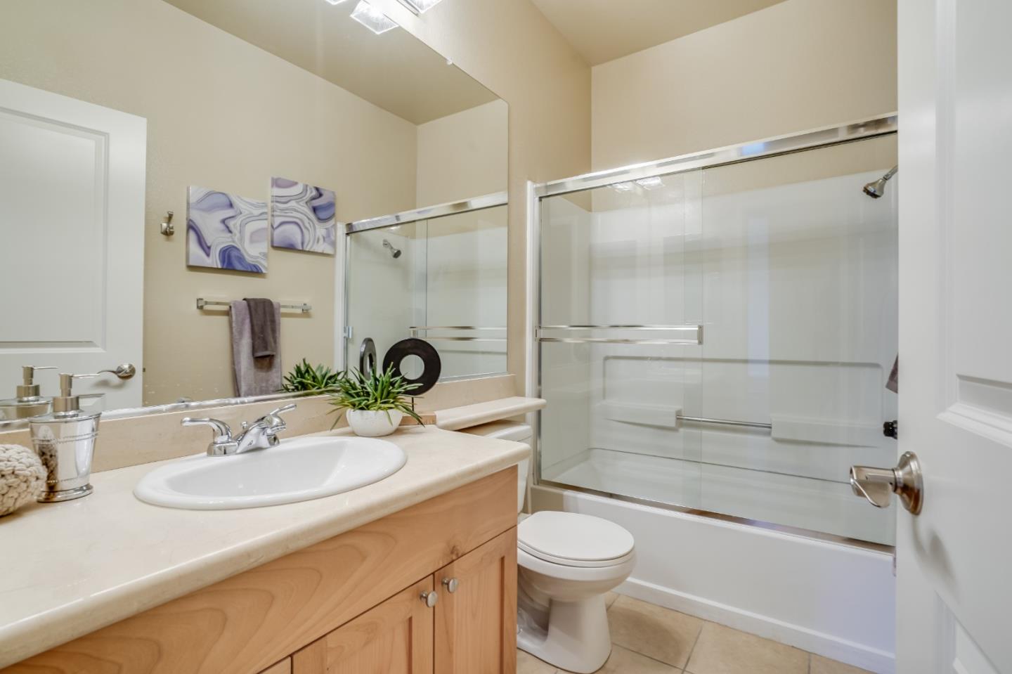 174 Copper Ridge Road San Ramon, CA 94582 - Photo 9 of 29 a bathroom with a granite countertop sink toilet a mirror and shower