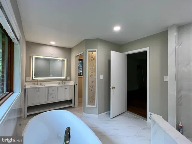 a view of a livingroom with furniture and window