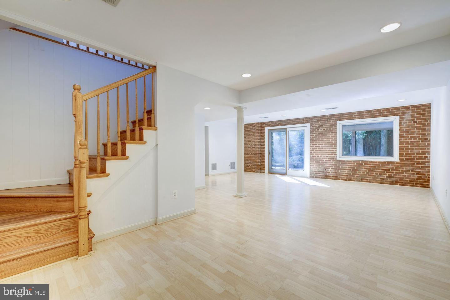 6710 Persimmon Tree Road Bethesda, MD 20817 - Photo 24 of 39 a view of an entryway with wooden floor and door