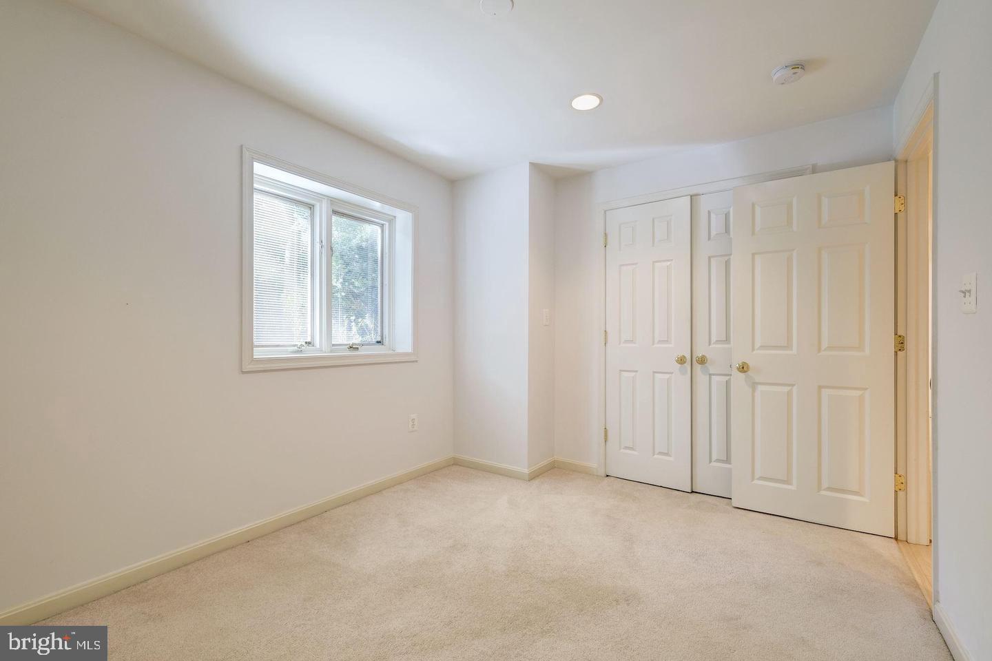 6710 Persimmon Tree Road Bethesda, MD 20817 - Photo 27 of 39 a view of an empty room with a window