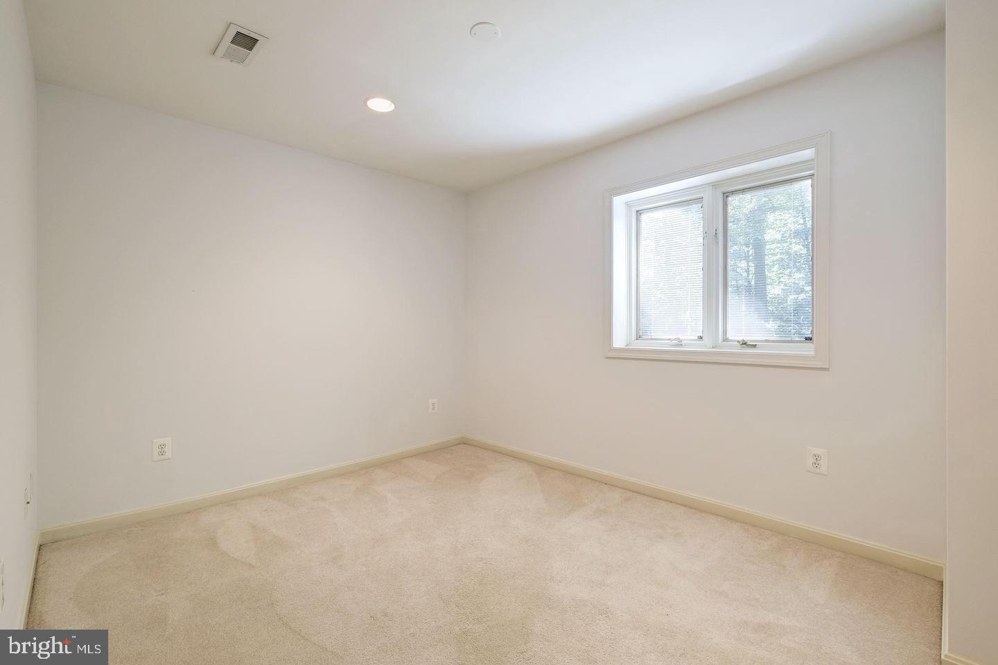 6710 Persimmon Tree Road Bethesda, MD 20817 - Photo 28 of 39 an empty room with a window