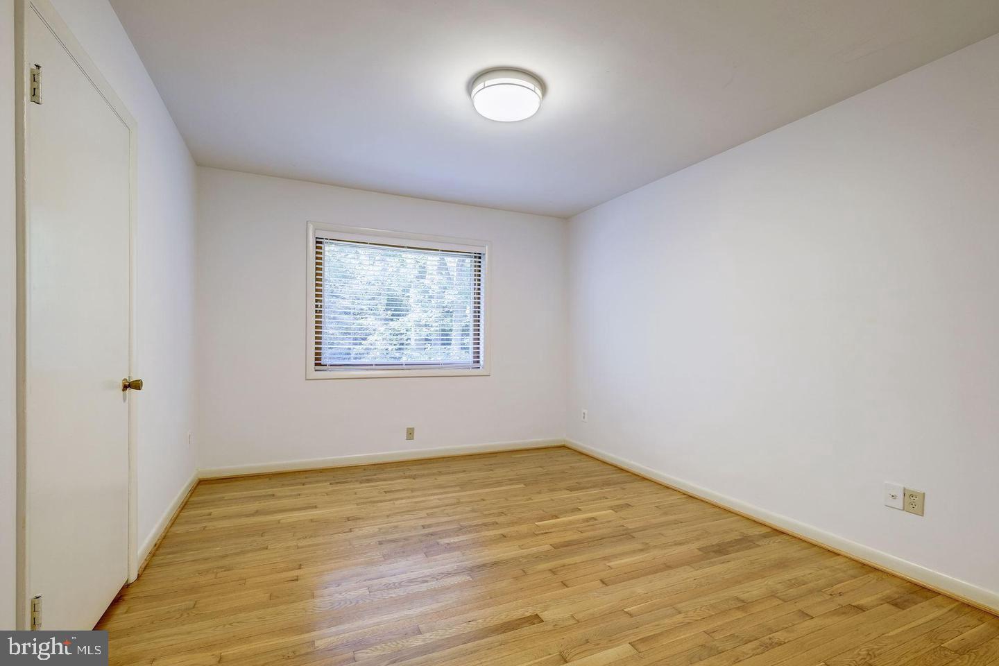 6710 Persimmon Tree Road Bethesda, MD 20817 - Photo 29 of 39 wooden floor in an empty room