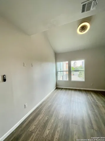 a bathroom with a sink shower and a mirror