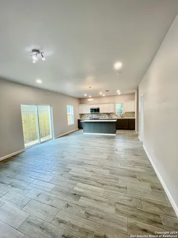a kitchen with a sink and cabinets