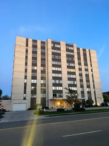 a view of a building and a city view