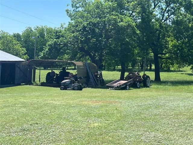 a view of a lake with beach in background