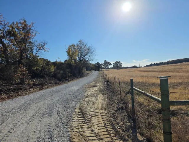 a view of a lake with a yard